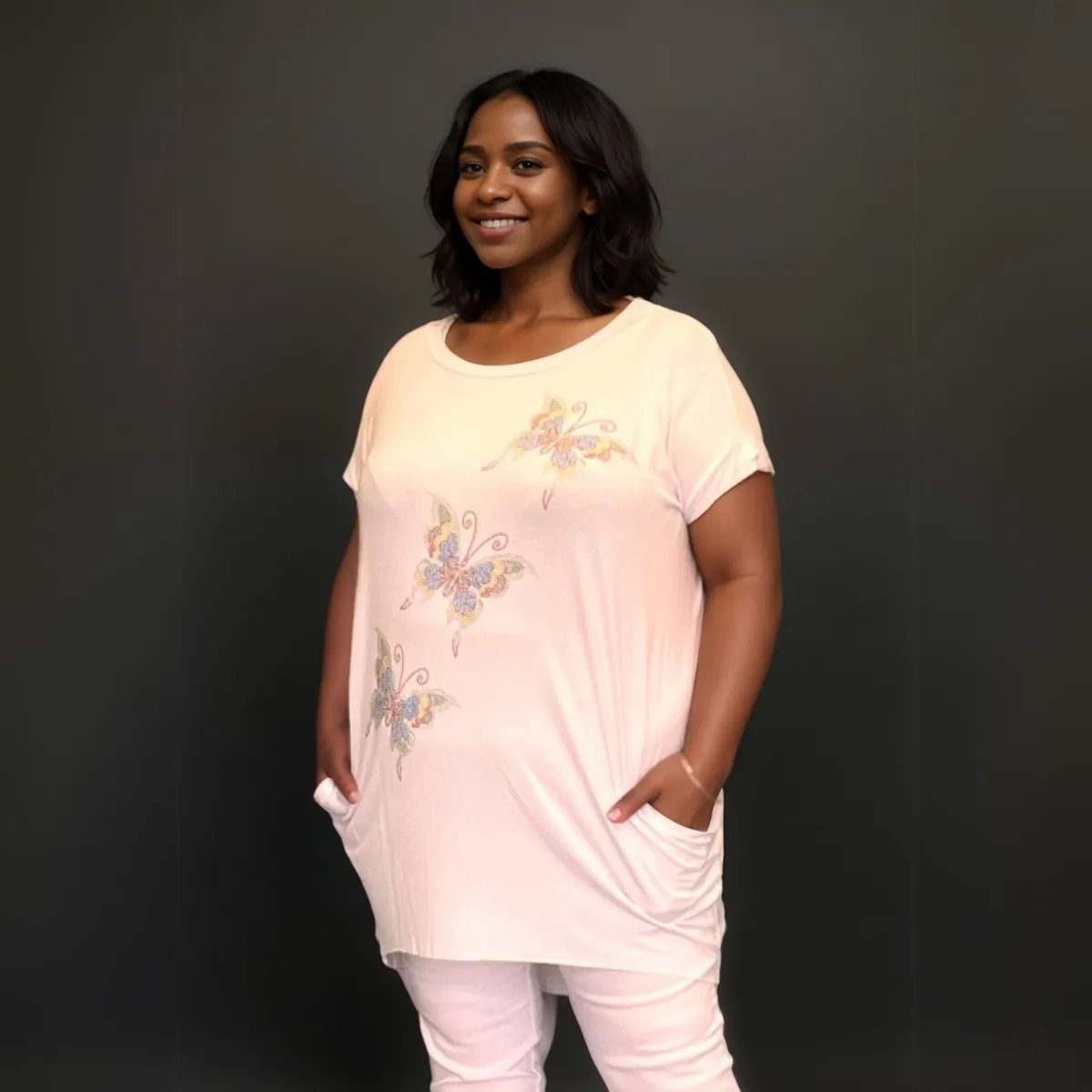 SEQUIN BUTTERFLY DIPPED HEM TOP WITH SIDE POCKETS