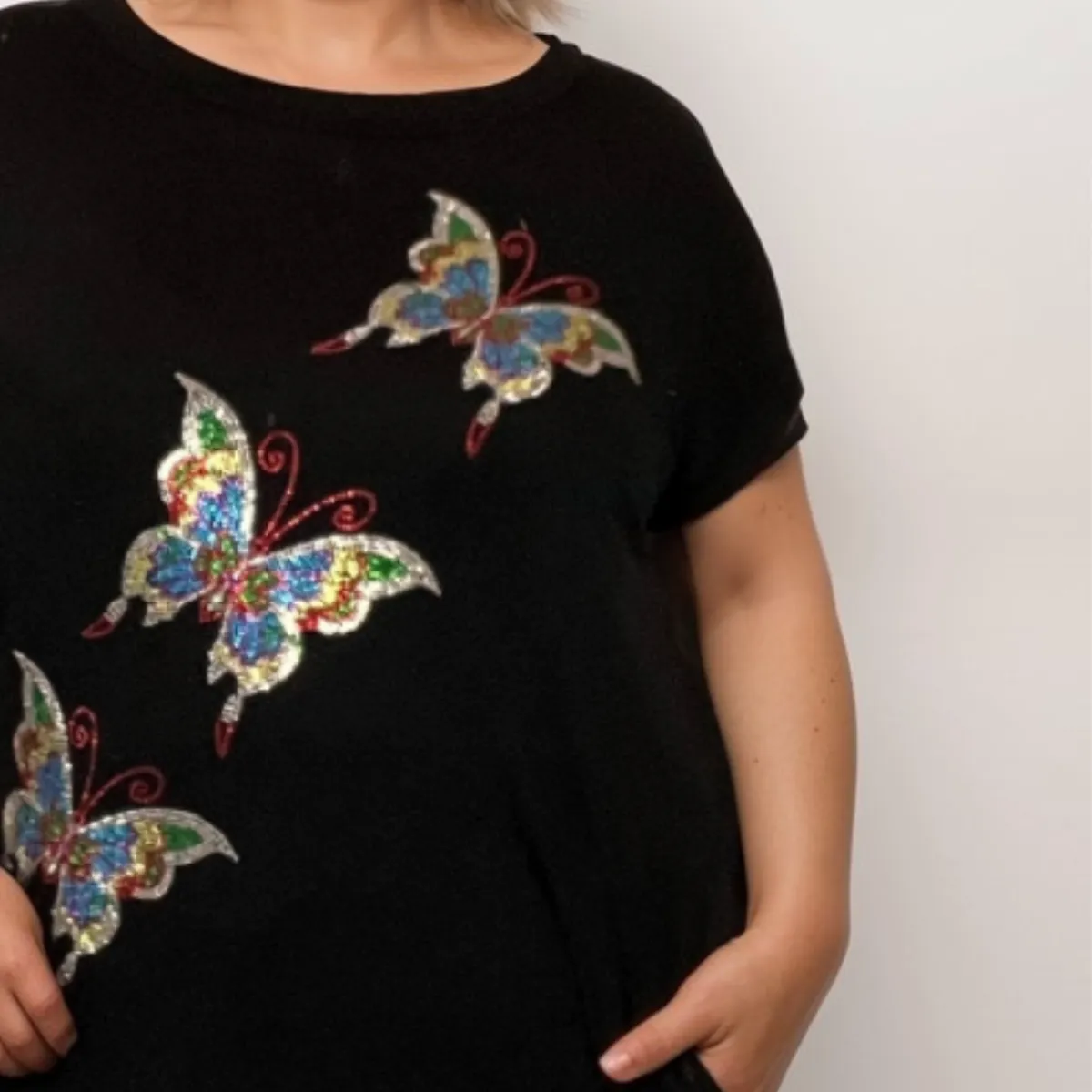 SEQUIN BUTTERFLY DIPPED HEM TOP WITH SIDE POCKETS