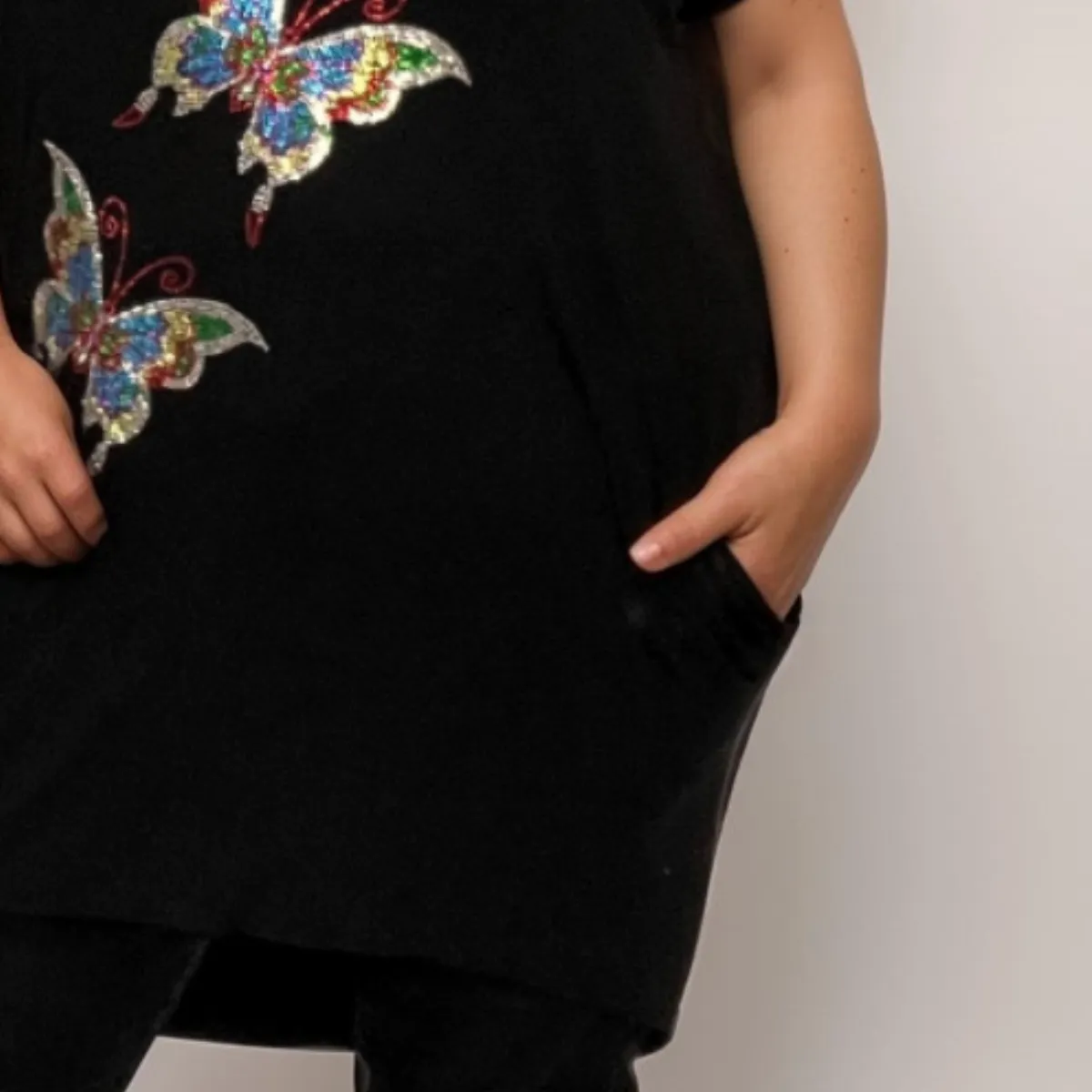 SEQUIN BUTTERFLY DIPPED HEM TOP WITH SIDE POCKETS
